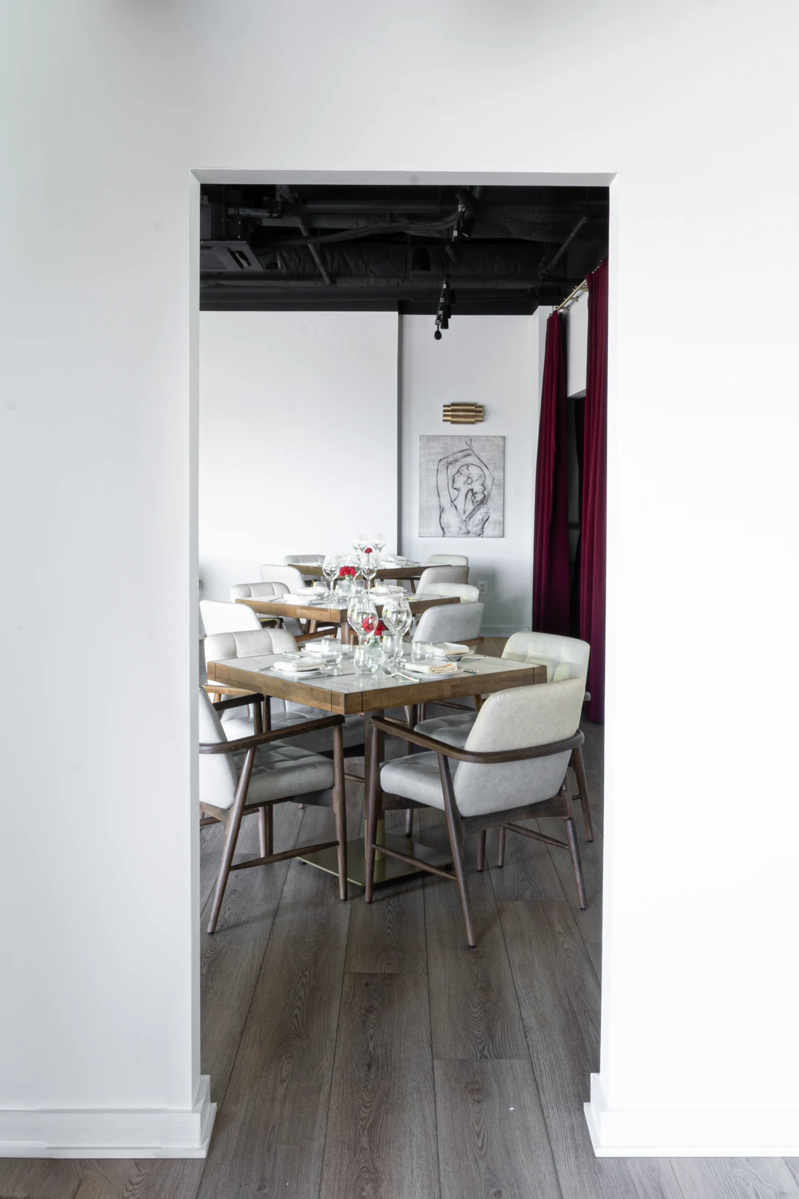 A private dining room framed by an intimate doorway at Josefina